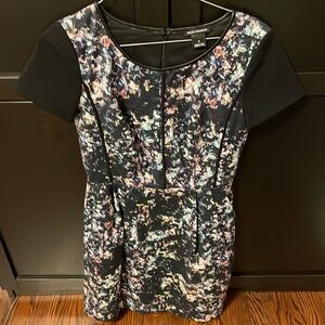 Club Monaco women’s size 0 round neck dress black with floral & piping. Lined.